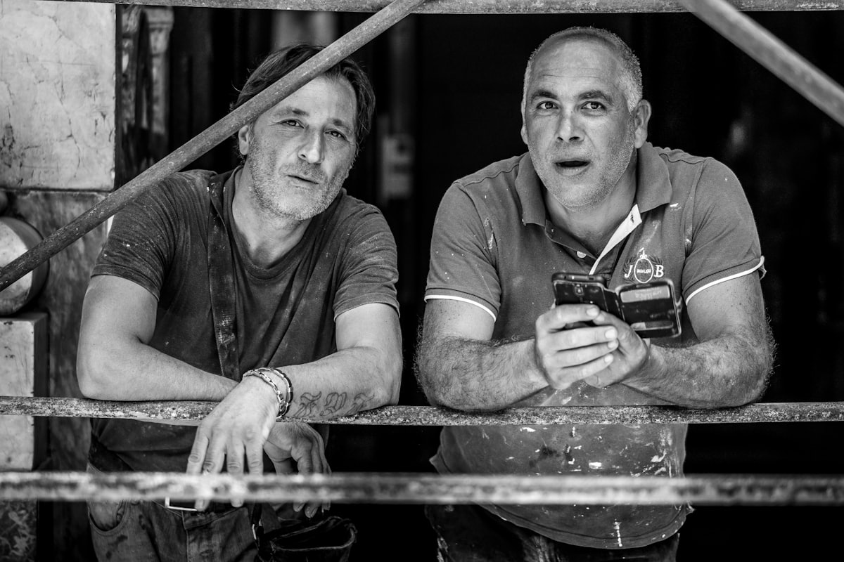 Two tradespeople on a job site